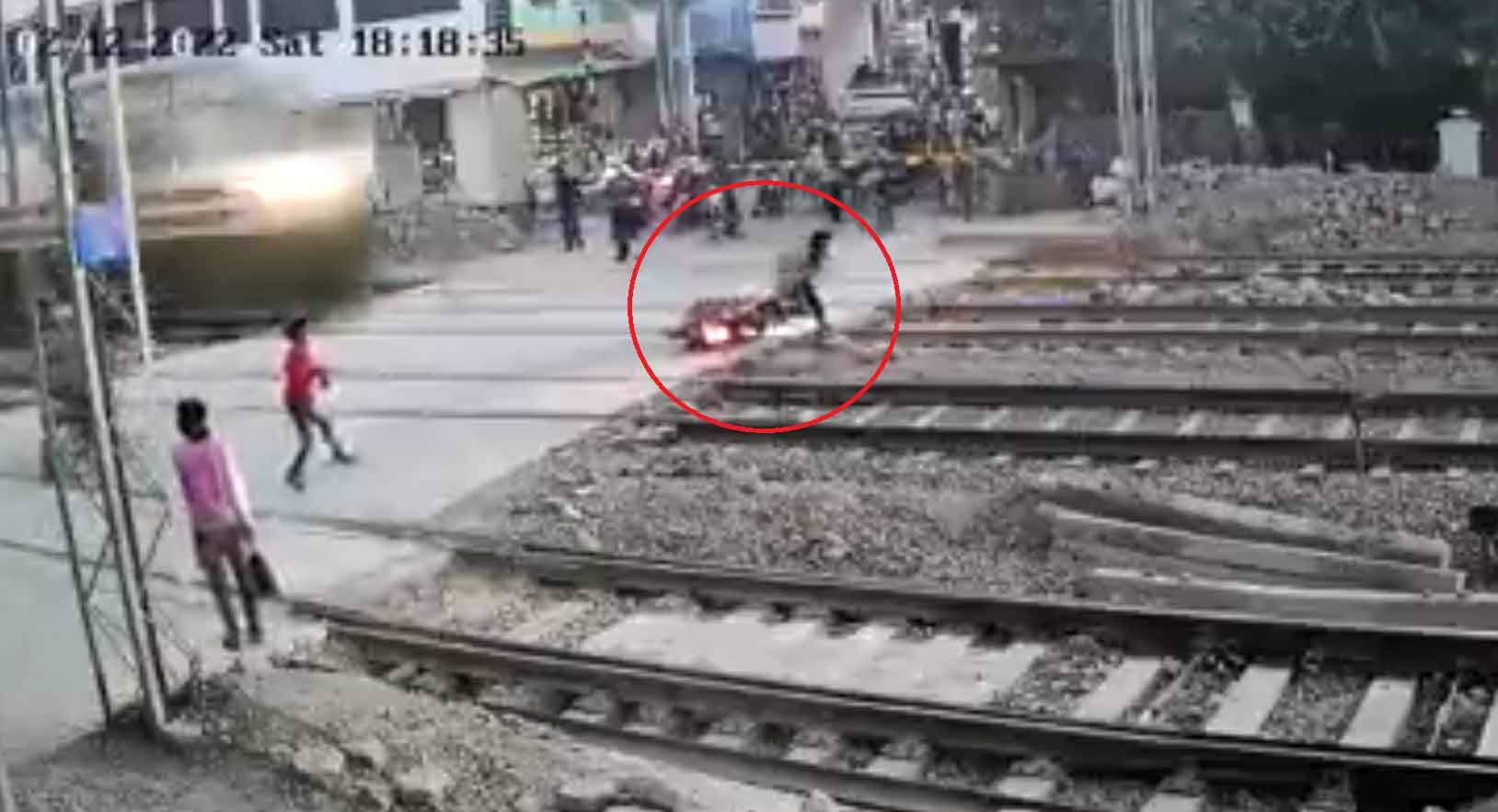 Watch: Biker narrowly escapes being hit by speeding train, leaves netizens  shocked